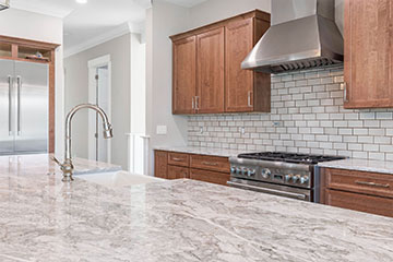 Island, range hood, and backsplash.